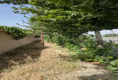 فروش زمین باغی سه نبش حاشیه جاده گلمکان ورودی شهر ۷۵۰۰ متر