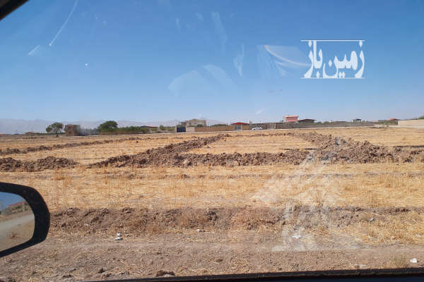 فروش زمین ۵۰۰ متری بر جاده اصلی روستای آزاد مرز اباد-1